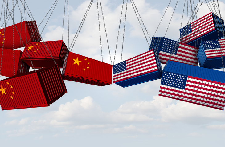 USA China trade war and American tariffs as opposing cargo freight containers in conflict as an economic and diplomatic dispute over import and exports