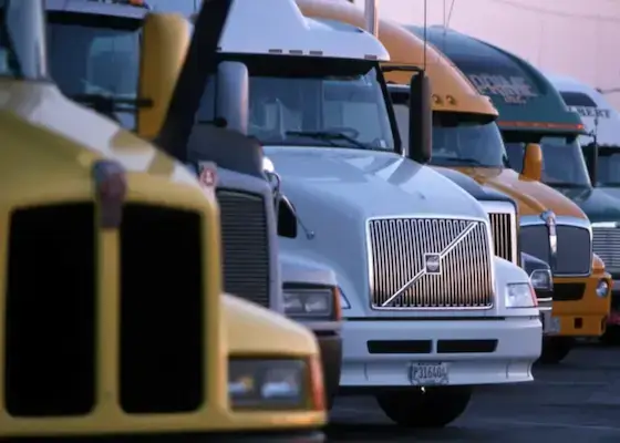 Domestic freight trucks lined up at a logistics yard for nationwide shipping and delivery