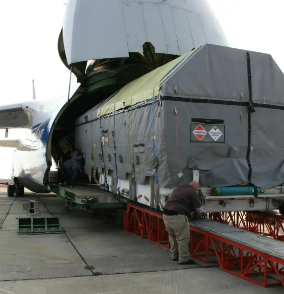 Jade International hazardous air freight being loaded into a cargo aircraft for international shipping.